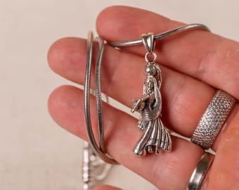 Adorn yourself with the divine love of Sri Radha with this pure 925 sterling silver pendant. A beautiful symbol of devotion and grace.