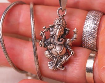 Discover this beautifully crafted pure silver pendant depicting Lord Ganesha, the auspicious deity, complete with a matching silver chain.