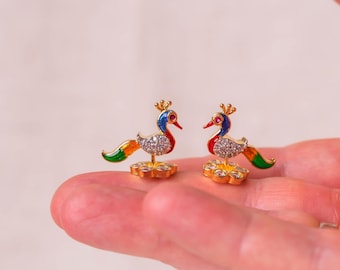 These exquisite 2 cm miniature metal peacocks are charming and spiritually significant adornments