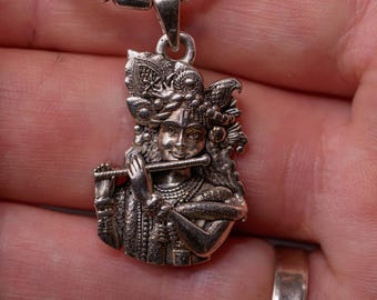 Krishna with Flute silver pendant with a silver chain would be a spiritually significant piece of jewelry for devotees of Lord Vishnu