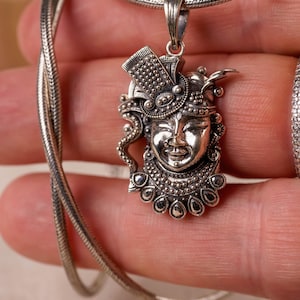 Krishna silver pendant with a silver chain would be a spiritually significant piece of jewelry for devotees of Lord Vishnu