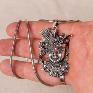 Krishna silver pendant with a silver chain would be a spiritually significant piece of jewelry for devotees of Lord Vishnu