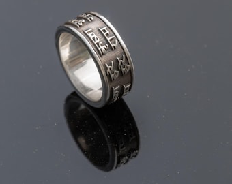 This exquisite silver ring, exquisitely inscribed with the sacred Mahamantra, is a deeply personal and powerful piece of devotional jewelry