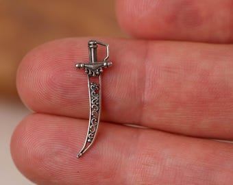 A 1-inch silver sword for deities would be a small yet significant ritual object, often used symbolically in the worship