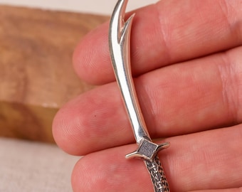 A 2.5-inch silver sword for deities would be a small yet significant ritual object, often used symbolically in the worship
