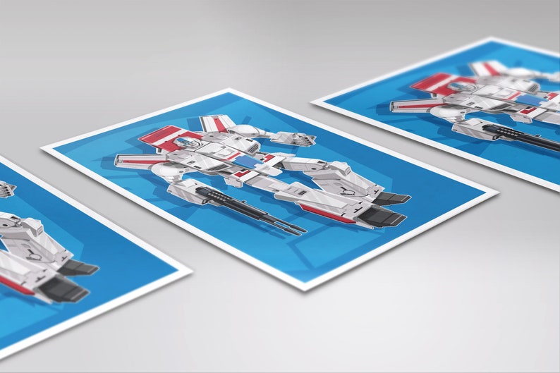 May include: A white, red, and blue robot toy in a cartoon style. The robot is in a standing position with its arms outstretched. The robot has a large head with a visor and a small mouth. The robot is holding two guns in its hands.