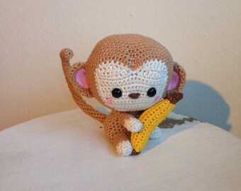Heel schattig gehaakt aapje Kiko, met banaan.