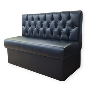 May include: Black tufted leather bench with a high back and a storage compartment. The bench is ideal for use in a restaurant or bar setting.