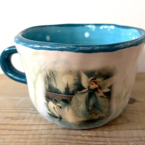 Ceramic peek-a-boo ghost mug - Millie's Pottery Midnight Blue Swan River Fairy with Peek-a-boo Ghost Mug Gift