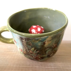 Ceramic peek-a-boo toadstool mug - Fairy Castle Stone Bridge Design with Flowers Peek-a-boo Toadstool Mug