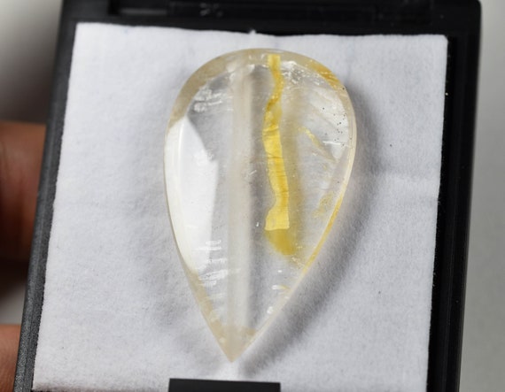 Large included Quartz with yellow Iron Oxide and mysterious white inclusion