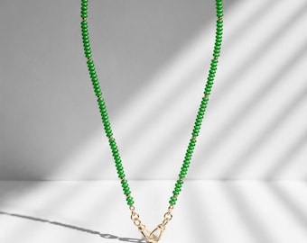 Green beaded necklace with two dog fob clasps