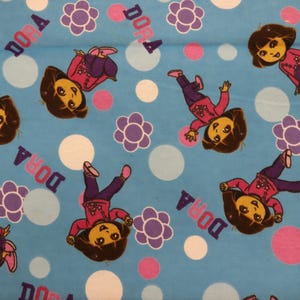 Dora the Explorer Floral Toss Cotton Flannel By Springs Creative Fabrics