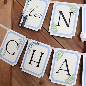 May include: A banner spelling "Her N Cha" with individual rectangular flags. Each flag has a white background with a light blue border and decorative floral elements. The letters are black. The first flag has the word "Her" in script.