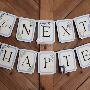 May include: A banner with the words "Her Next Chapter" in black letters on cream-colored cards with a light blue border. The banner includes illustrations of books, glasses, and a ring, strung on a white ribbon.