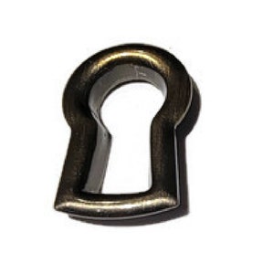 May include: A keyhole-shaped metal escutcheon in an antique brass finish.