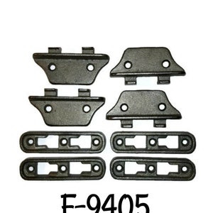 May include: A set of eight black metal brackets and four black metal strips with holes. The brackets have two holes each and the strips have three holes each. The set is labeled "F-9405".