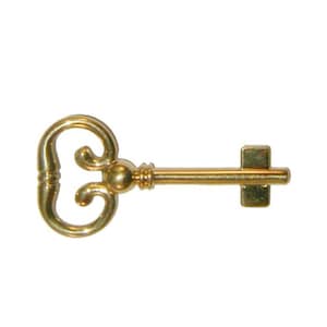 May include: A gold-colored skeleton key with a decorative, ornate head and a straight shaft.