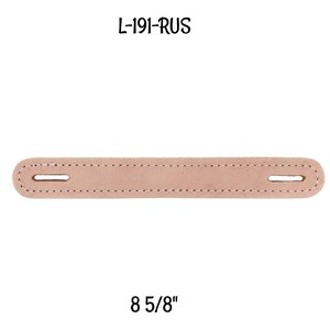 May include: A light pink leather strap with two holes and stitching around the edges. The strap is 8 5/8 inches long. The text "L-191-RUS" is printed above the strap.