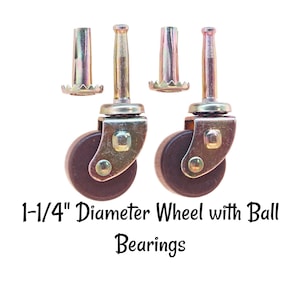 May include: Two brown 1-1/4" diameter wheels with ball bearings and metal stems. Each wheel has a metal screw-in attachment with a serrated edge.