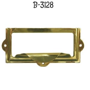 May include: A gold-colored metal nameplate with a beveled edge and rounded corners. The nameplate has a slot for inserting a card or label. The nameplate is labeled "B-3128".