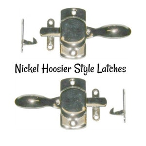 May include: Two nickel Hoosier style latches with a lever handle and a hook latch. The latches are shown in a close-up view.