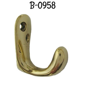 May include: A brass hook with a curved design. The hook is solid brass and has a smooth finish. The hook is labeled "B-0958".