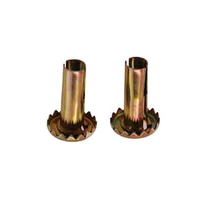 May include: Two gold metal furniture leg inserts with a serrated edge. The inserts are designed to be used with furniture legs to prevent them from scratching floors.