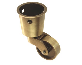 May include: A brass swivel caster with a round wheel and a threaded top for attaching to furniture.