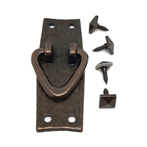 May include: A bronze-colored metal pull handle with a triangular shape and a rounded top. The handle is attached to a rectangular plate with two holes for mounting screws. Four screws are included.