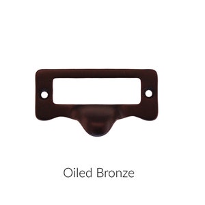 May include: Oiled bronze drawer pull with a rectangular label holder.