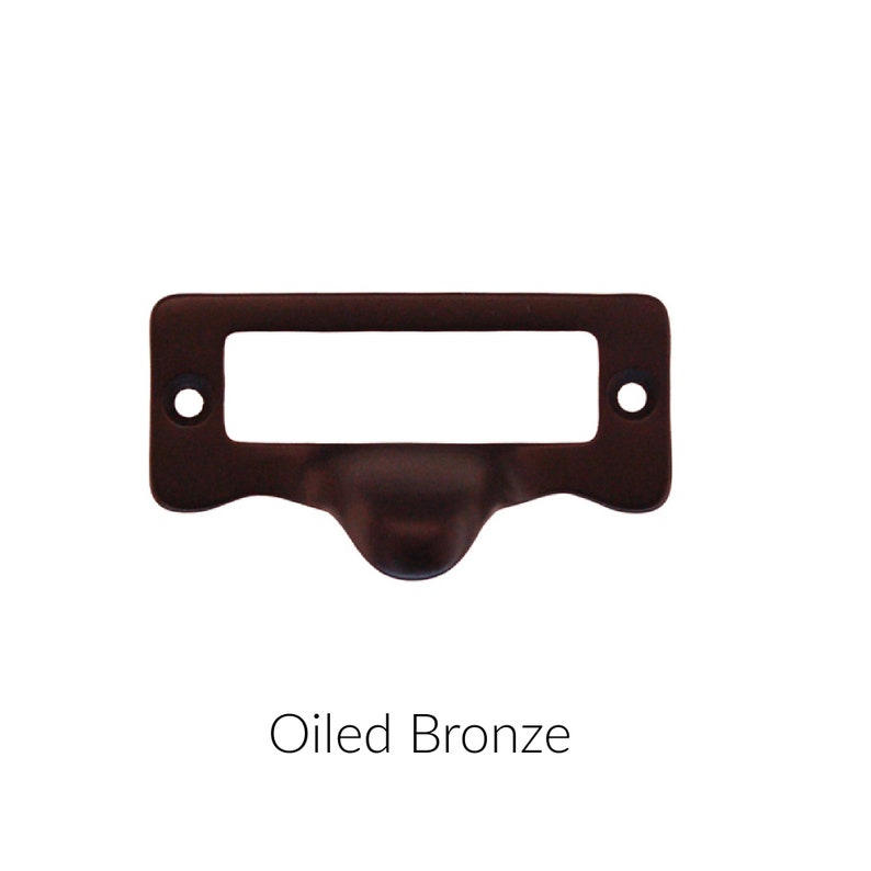 May include: Oiled bronze drawer pull with a rectangular label holder.