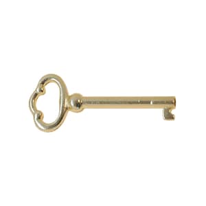 May include: A gold-colored skeleton key with a decorative, heart-shaped bow.