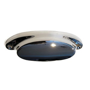 May include: A chrome-plated cabinet pull with a rounded, oval shape. The pull has a smooth, shiny finish.