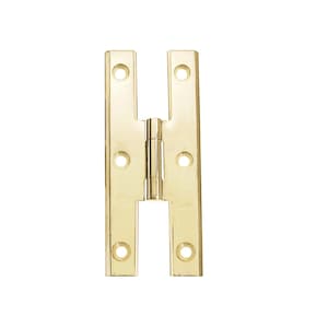 May include: A pair of gold-toned, flat, decorative hinges with a simple design. The hinges are made of metal and have a polished finish.