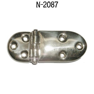 May include: A silver-toned metal hinge with a rounded shape and multiple screw holes. The hinge is designed for use with furniture or other objects.