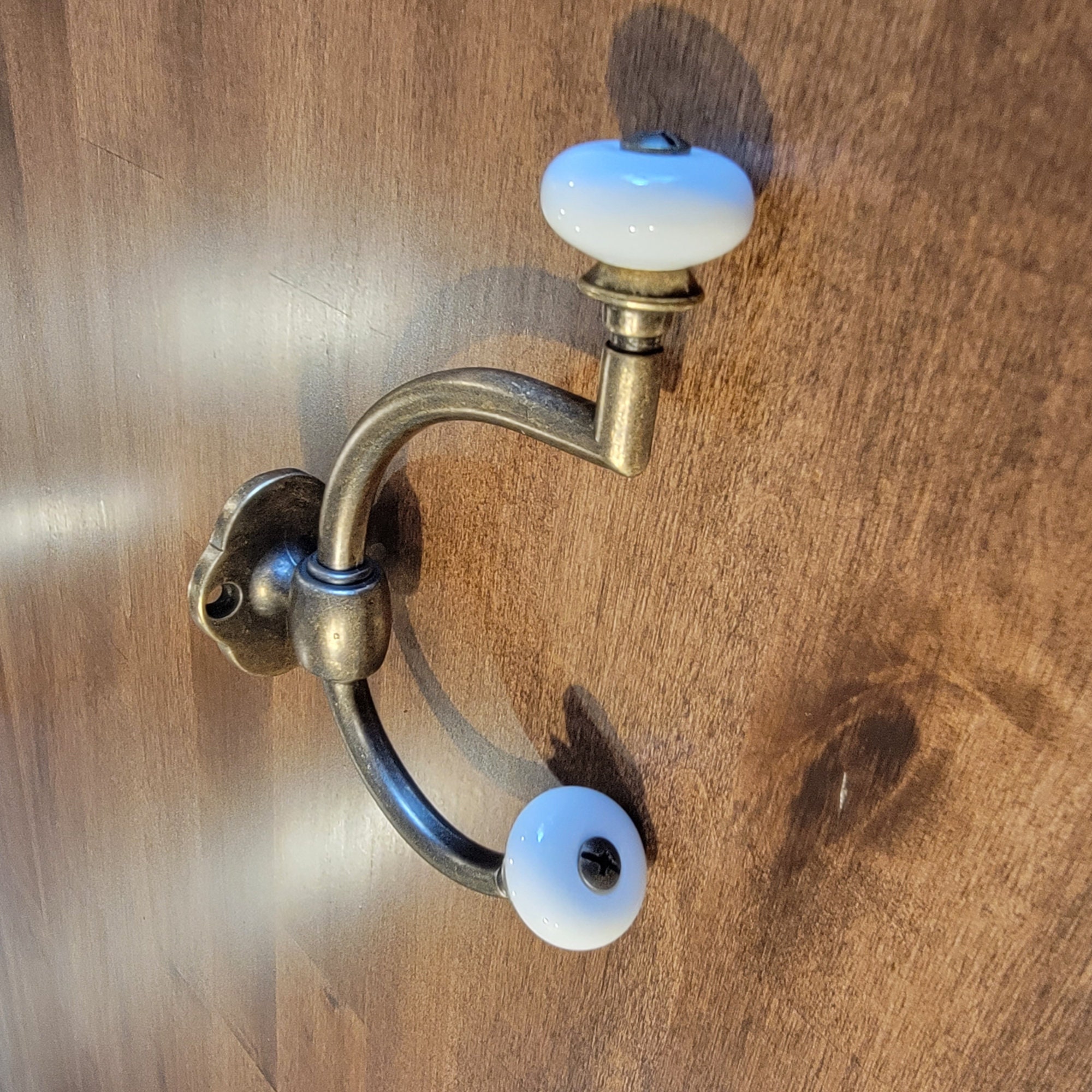 Antique brass coat hooks with porcelain knobs sale