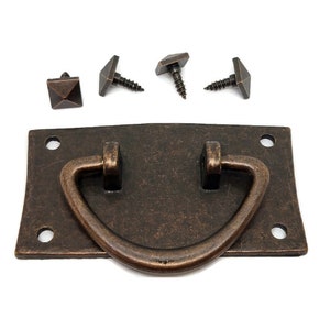 May include: A rustic, antique-style,  rectangular cabinet pull with a curved,  D-shaped handle. The pull is made of metal with a dark brown finish and has four screw holes. The pull comes with four screws.