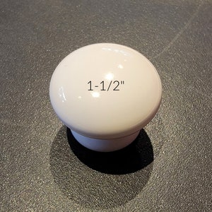 May include: White plastic knob with a 1-1/2 inch diameter.