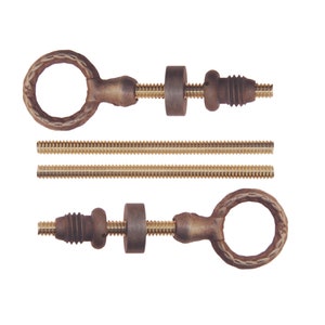 May include: Antique bronze-colored hardware set featuring two ring-shaped handles with decorative detailing, threaded rods, and cylindrical and conical components. The set includes two threaded rods and two ring handles with matching hardware.