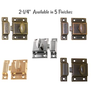 May include: Five different finishes of a 2-1/4 inch cabinet latch. The latches are made of metal and have a traditional design. The finishes include antique brass, polished brass, satin nickel, oil rubbed bronze, and black.