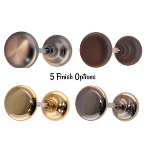 May include: Five different finishes of a round door knob set. The finishes are: oil rubbed bronze, dark oil rubbed bronze, polished brass, satin nickel, and polished nickel.