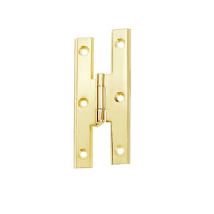 May include: A pair of gold-toned,  H-shaped,  door hinges with a polished finish.