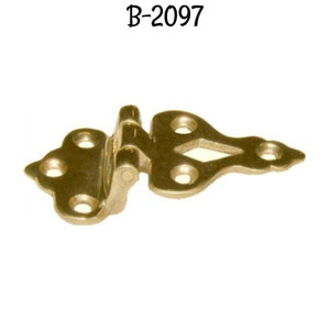May include: Brass hinge with a decorative, ornate design. The hinge is in the shape of a teardrop with a diamond-shaped cutout. The hinge is labeled "B-2097".