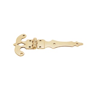 May include: A gold-toned decorative hinge with a decorative, ornate design. The hinge is made of metal and has a traditional style.