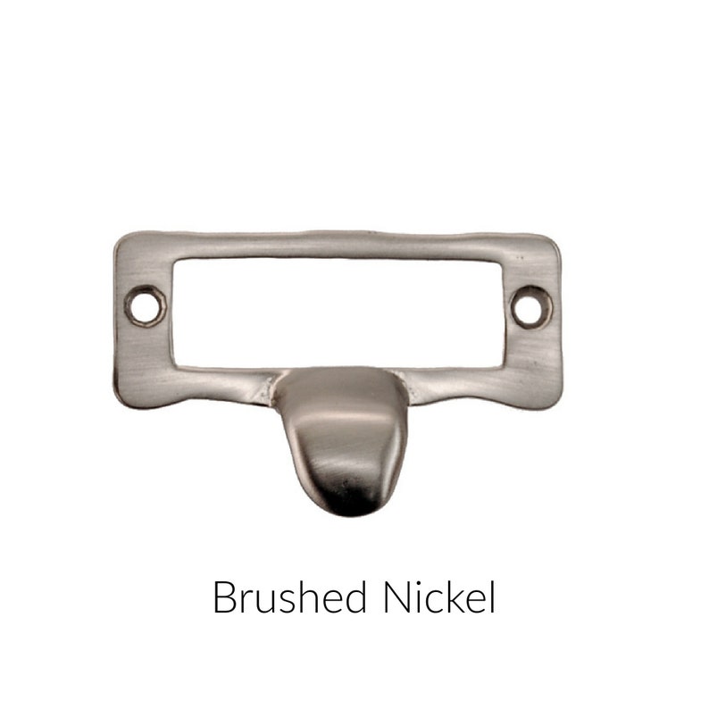 May include: Brushed nickel drawer pull with a rectangular label holder.
