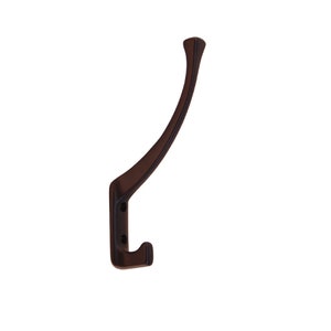May include: A dark brown metal hook with a curved design. The hook is mounted on a white background.
