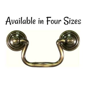 May include: Antique brass cabinet pull with a rounded, decorative design. Available in four sizes.