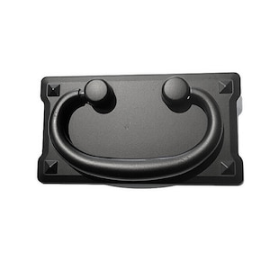 May include: Black metal drawer pull with a rectangular base and a rounded, arched handle.