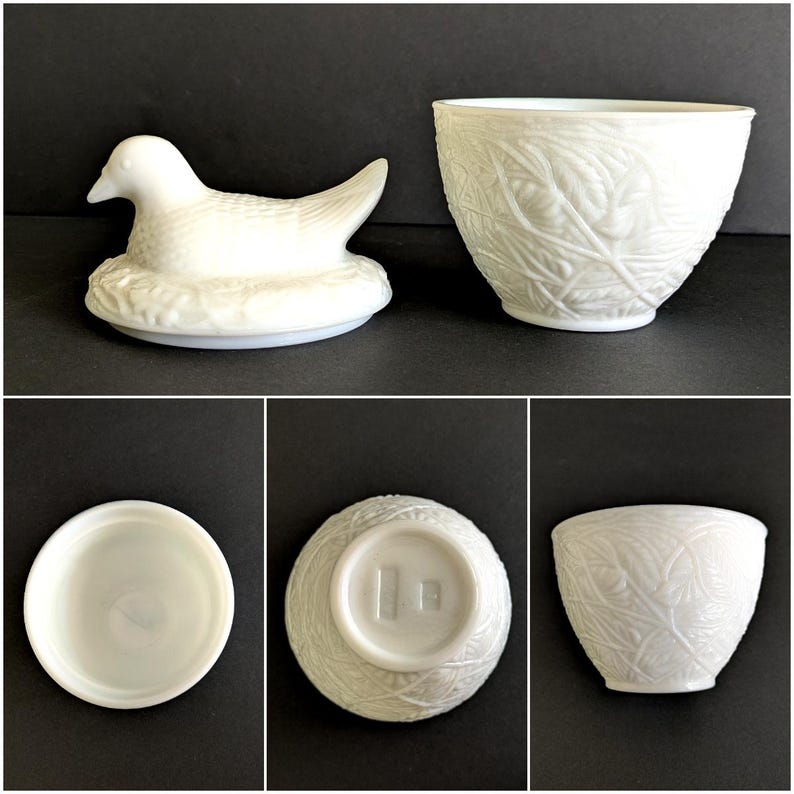 Puede incluir: Una figura de pato de cer&aacute;mica blanca sobre un nido y un cuenco de cer&aacute;mica blanca con un patr&oacute;n de hojas. El pato est&aacute; detallado con plumas. El cuenco tiene una superficie texturizada. La base del cuenco tiene un sello.
